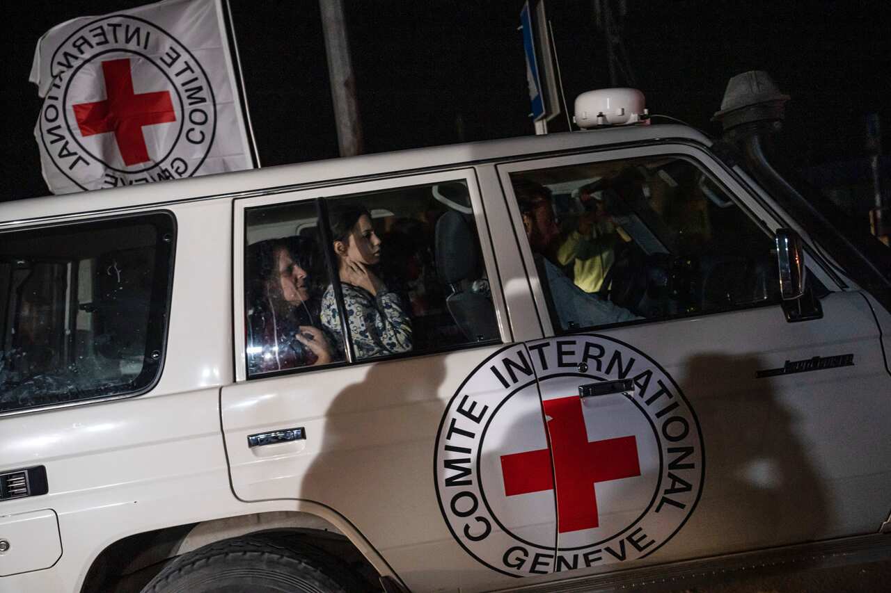 A Red Cross vehicle carrying Israeli hostages.