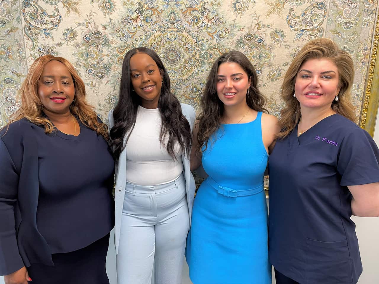 Emily Korir standing with her daughter Britney, Nadia Willison and Dr Fariba Willison.