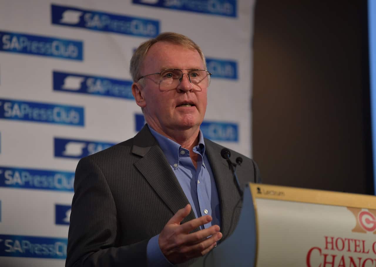 A man speaking at a podium.