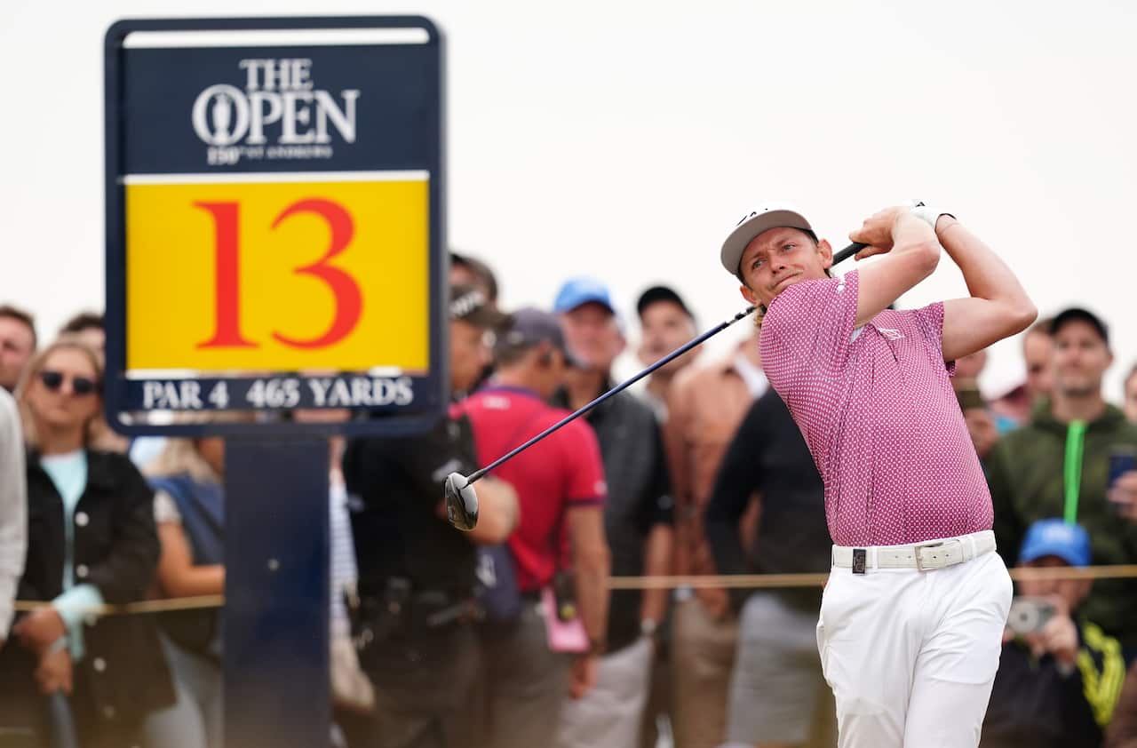 A man swinging a golf club.