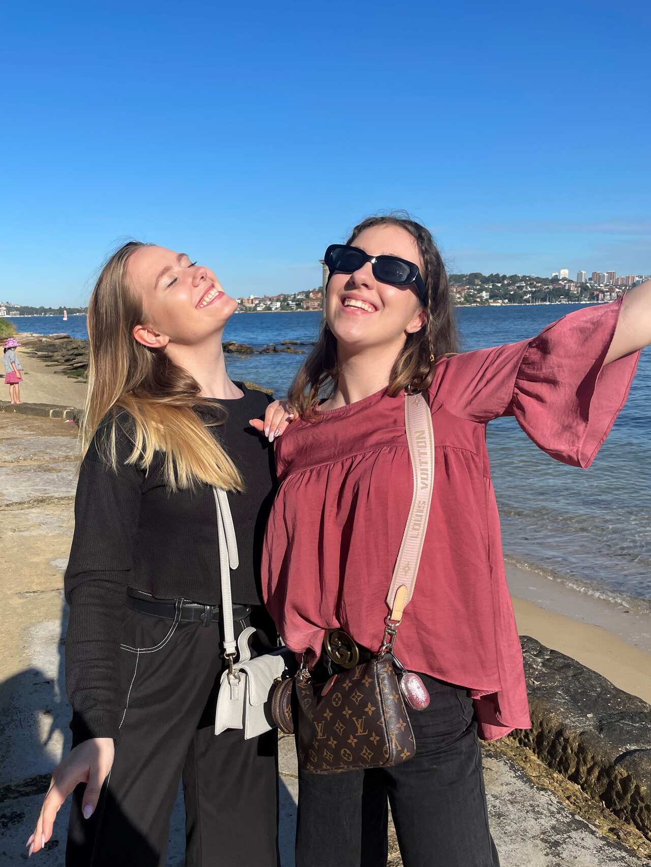 Two women smiling outside