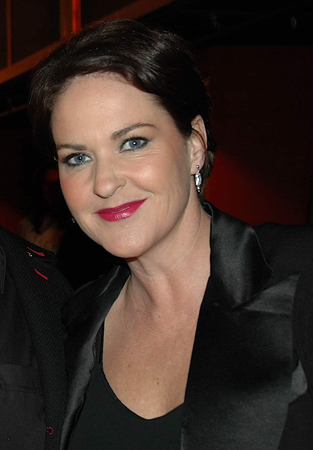 A woman wearing a black jacket 