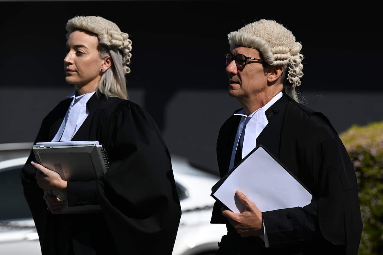 A man and a woman arrive at the ACT Supreme Court.