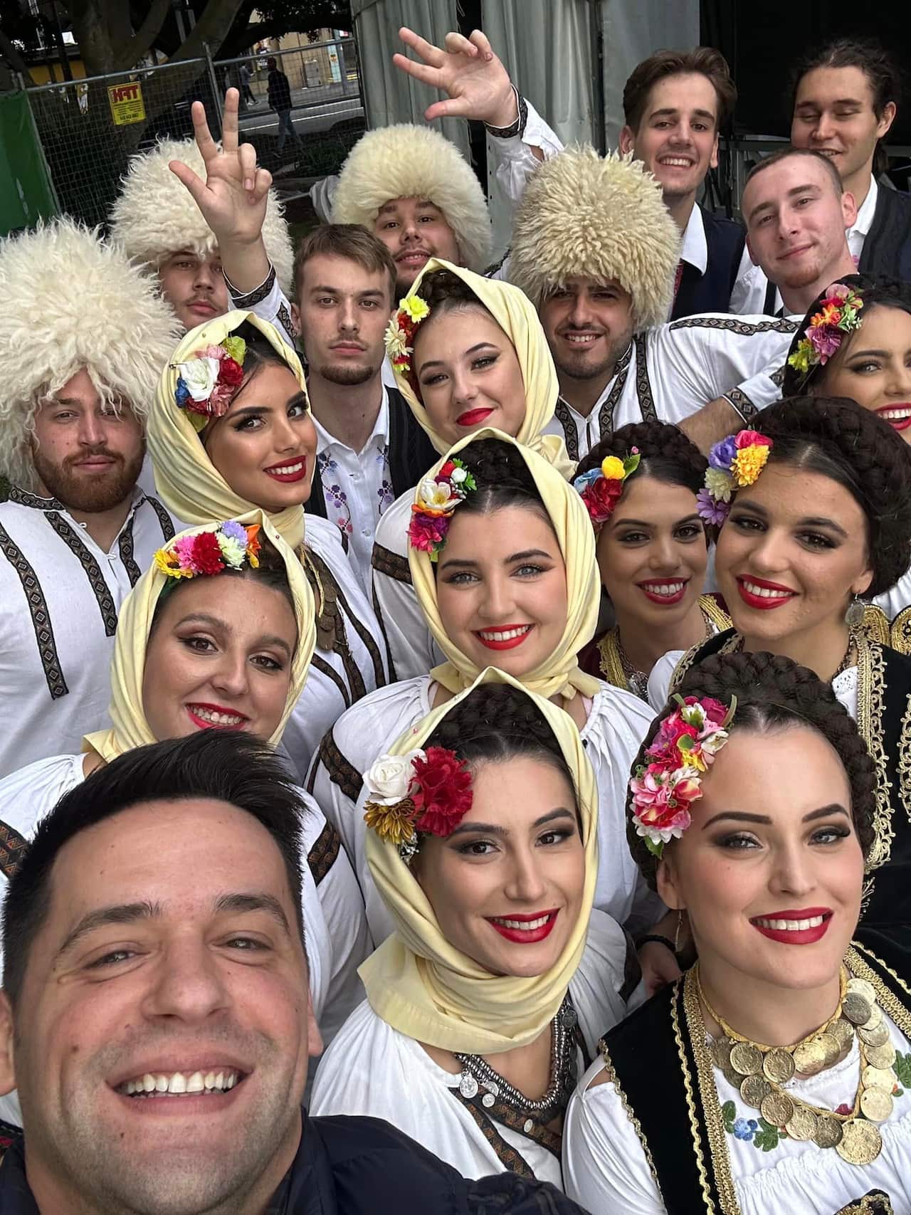 Ravna Gora Ensemble dancers pose for a group photo with choreographer Stanko Dimitrijevic