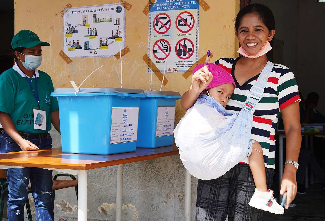 Each voter left the polling stations with a distinct souvenir, a finger dyed purple, to show that they’d cast their vote.  