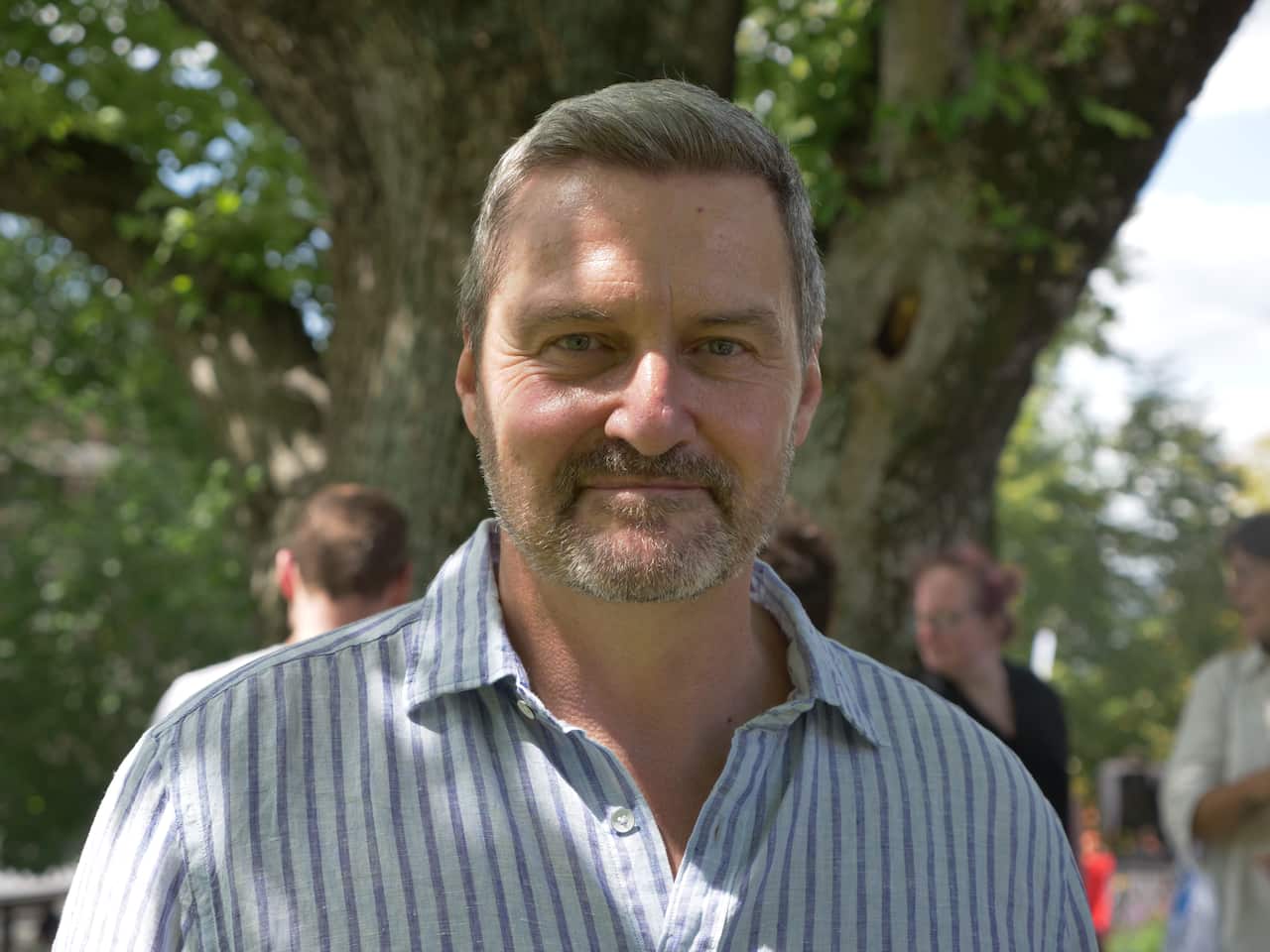 Man looking into camera. 