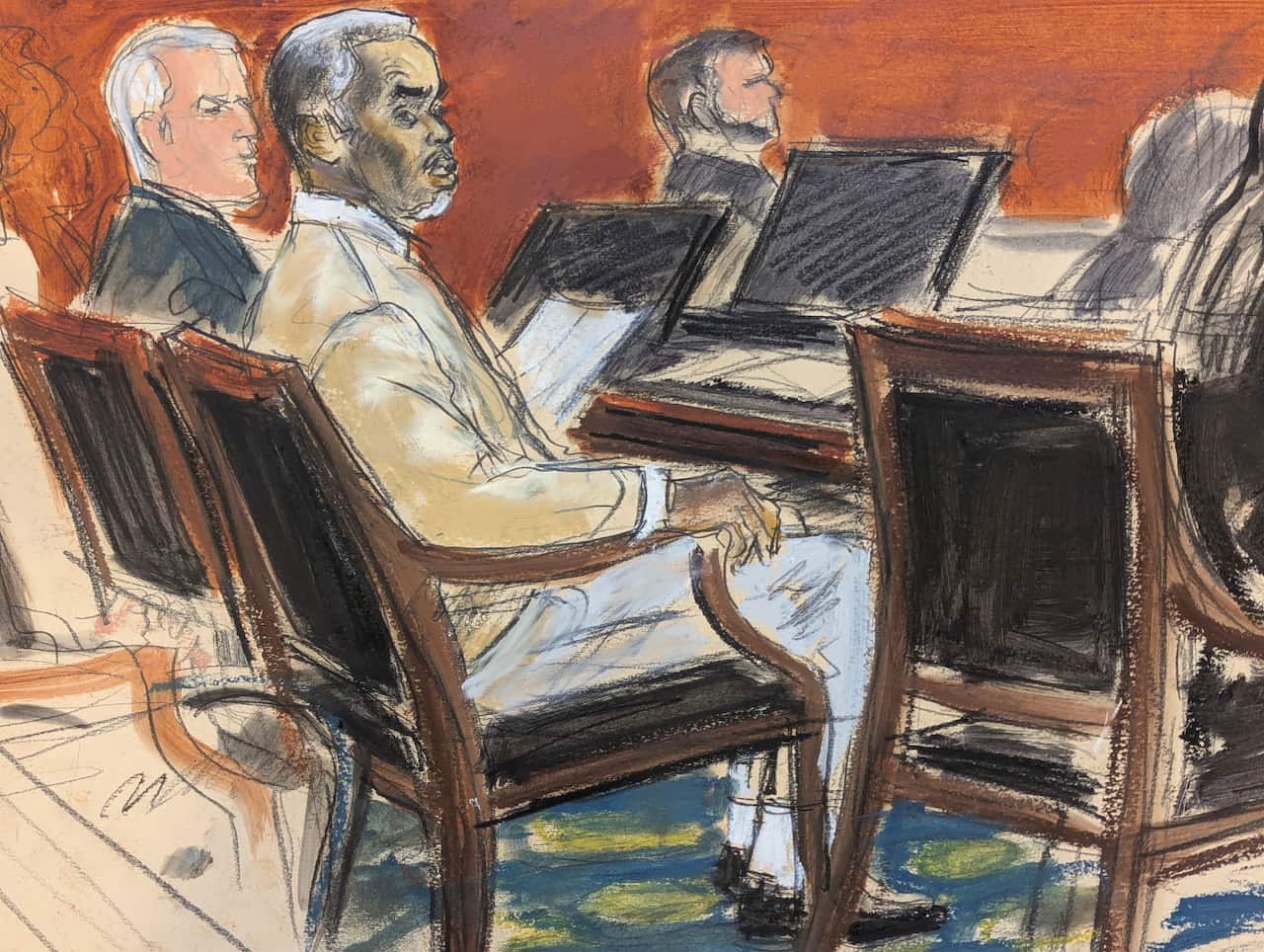 A court drawing of Sean 'Diddy' Combs in a suit sitting on a chair next to his lawyers.