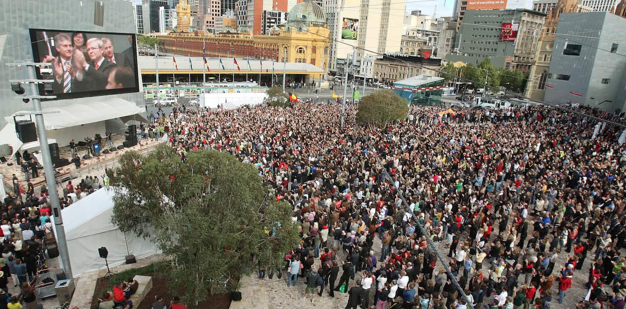 Thousands watch a giant television scree