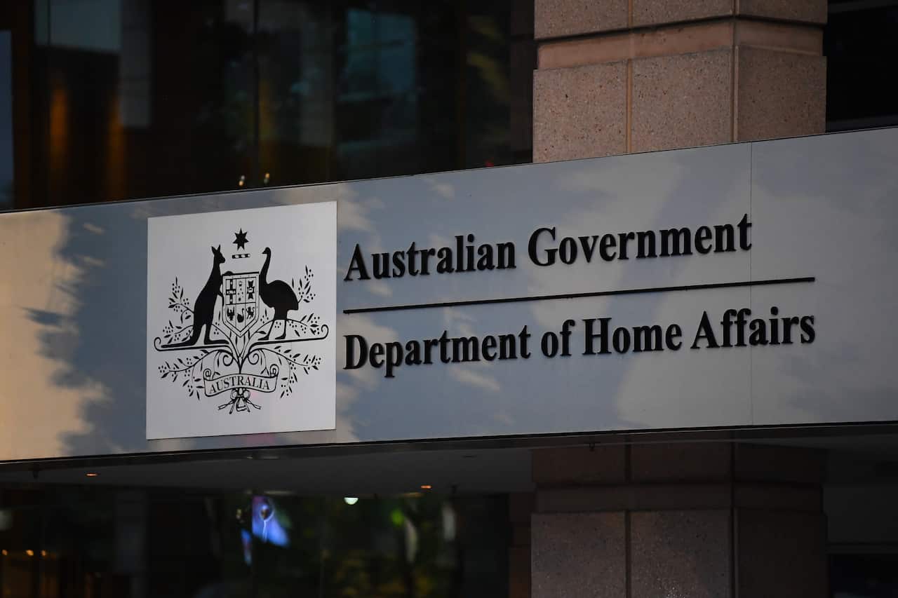 A sign on a building that reads: Australian Government: Department of Home Affairs
