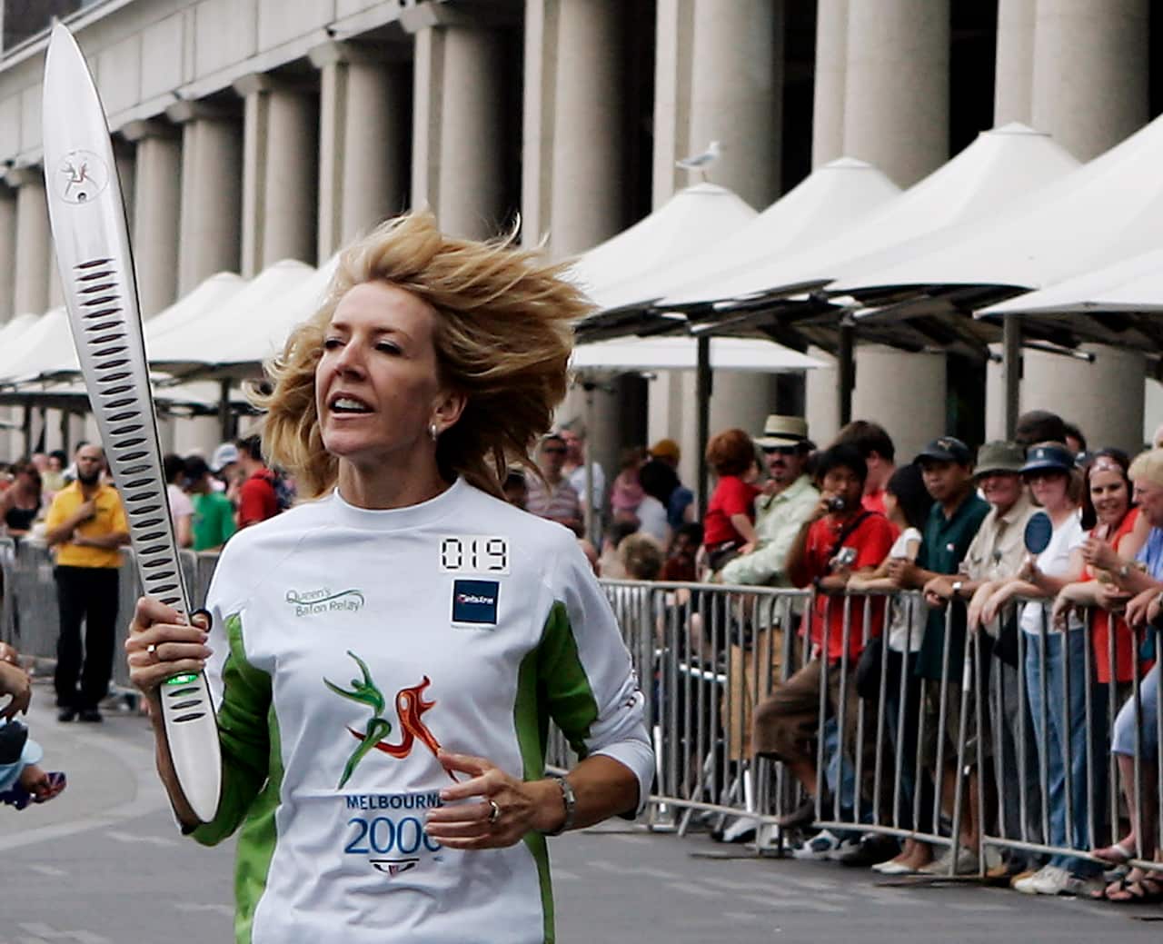 Jane Fleming holding the Commonwealth Games Queen’s Baton in Sydney's Circular Quay in 2006.