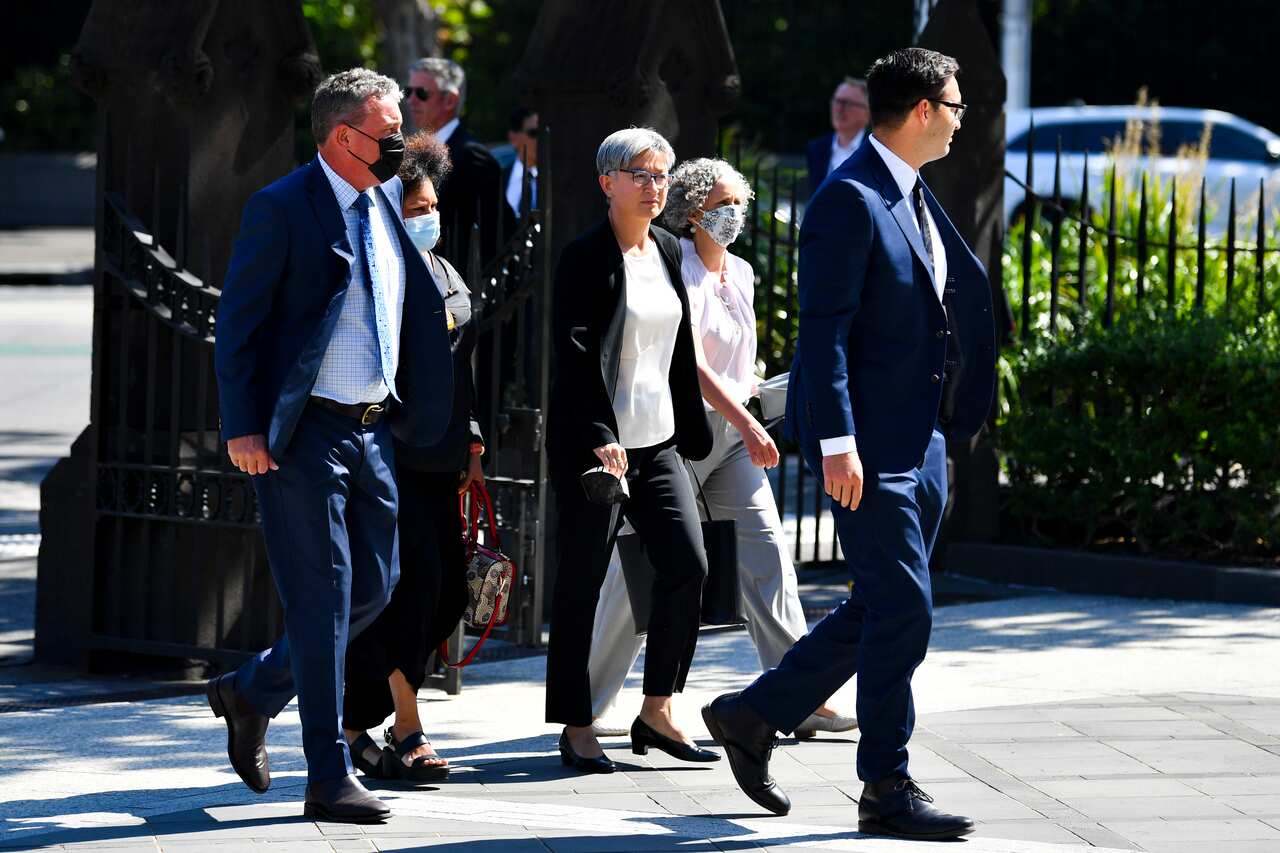 The Leader of the Opposition in the Senate Penny Wong (centre) arrives ahead of the funeral service for Senator Kimberley Kitching at St Patrick's Cathedral.