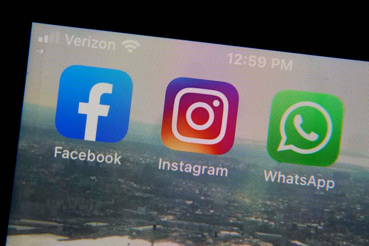 The mobile phone apps for, from left, Facebook, Instagram and WhatsApp are shown on a device