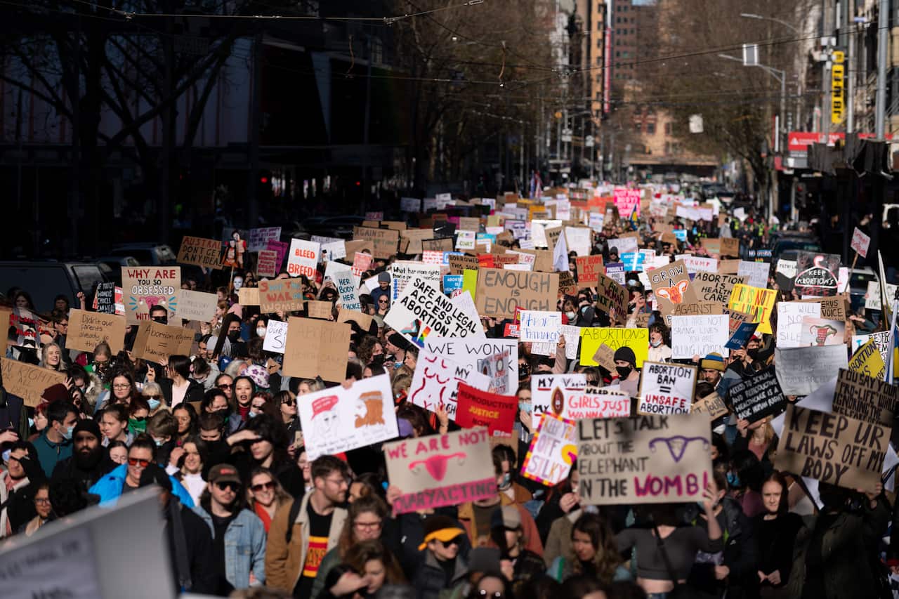 Pro-choice protesters hold placards expressing their opinion during the demonstration. 