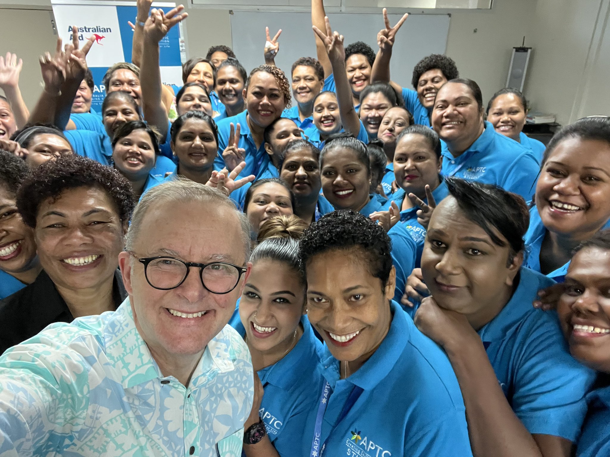 Anthony Albanese poses for a selfie with nurses in Fiji