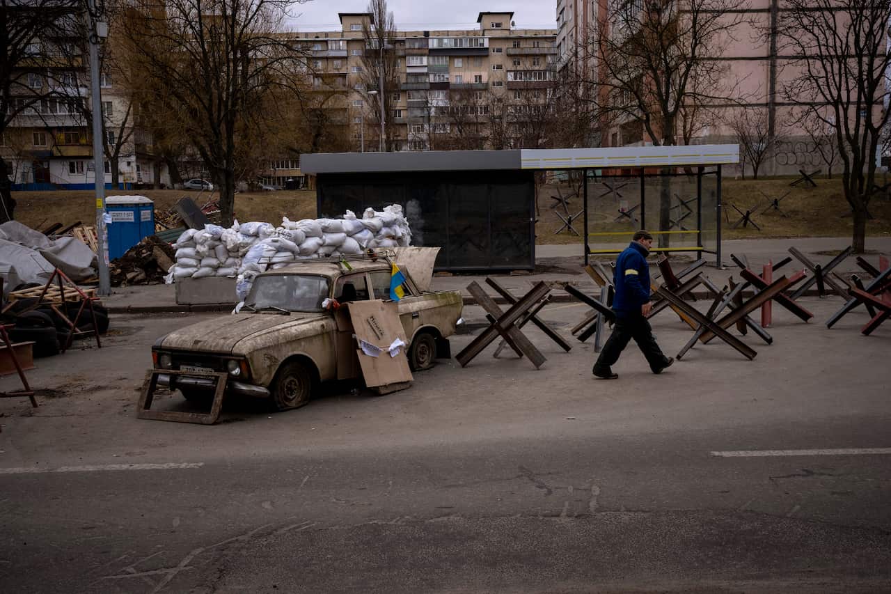 A checkpoint set up at a road heading to the Ukrainian city of Kyiv is seen.