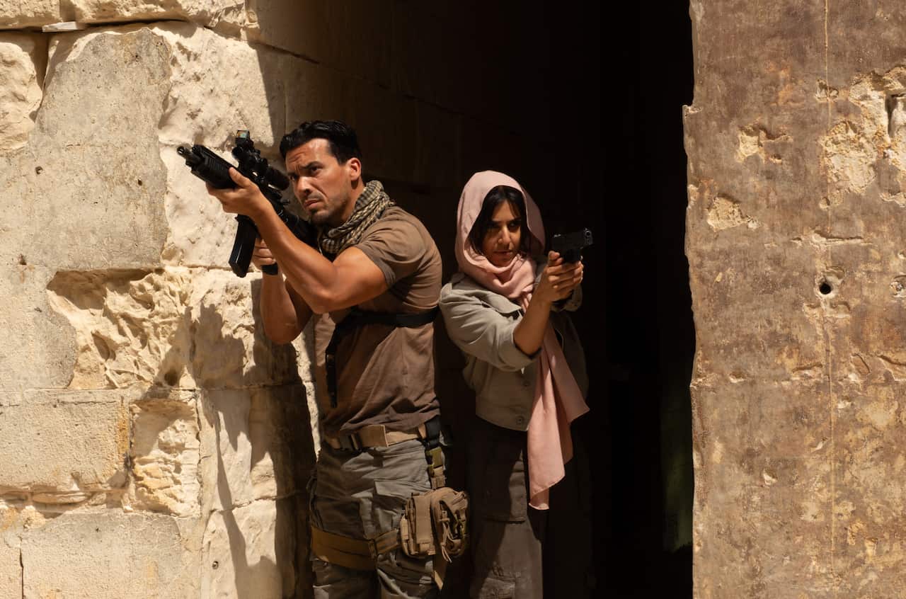 Tewfik Jallab as Vincent Taleb and Ritu Arya as Zara Taylor and in 'Apollo Has Fallen'.