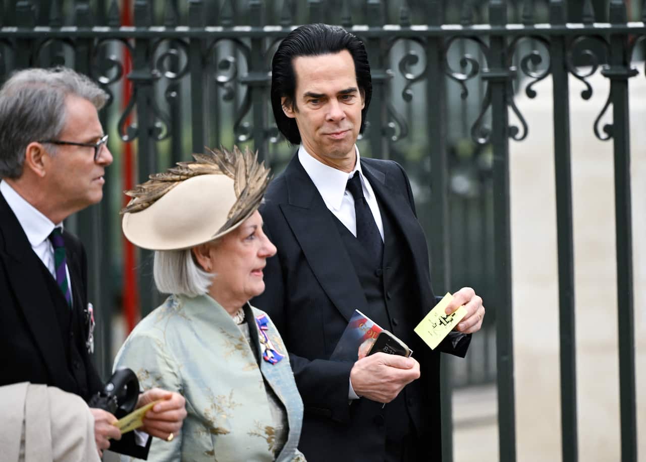 Nick Cave and guests arrive ahead of the coronation ceremony of King Charles III and Queen Camilla at Westminster Abbey in London.