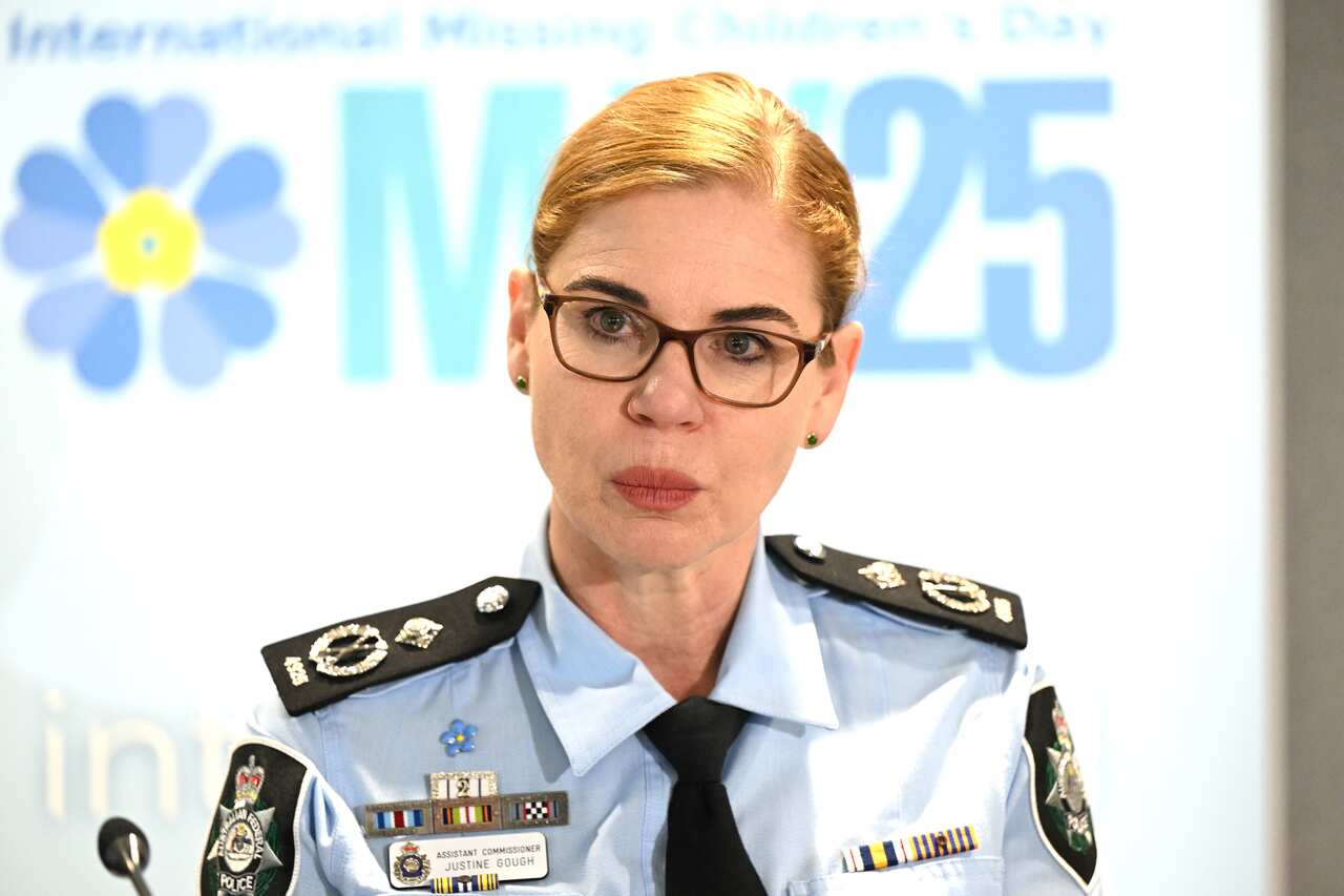 A woman standing at a lectern.