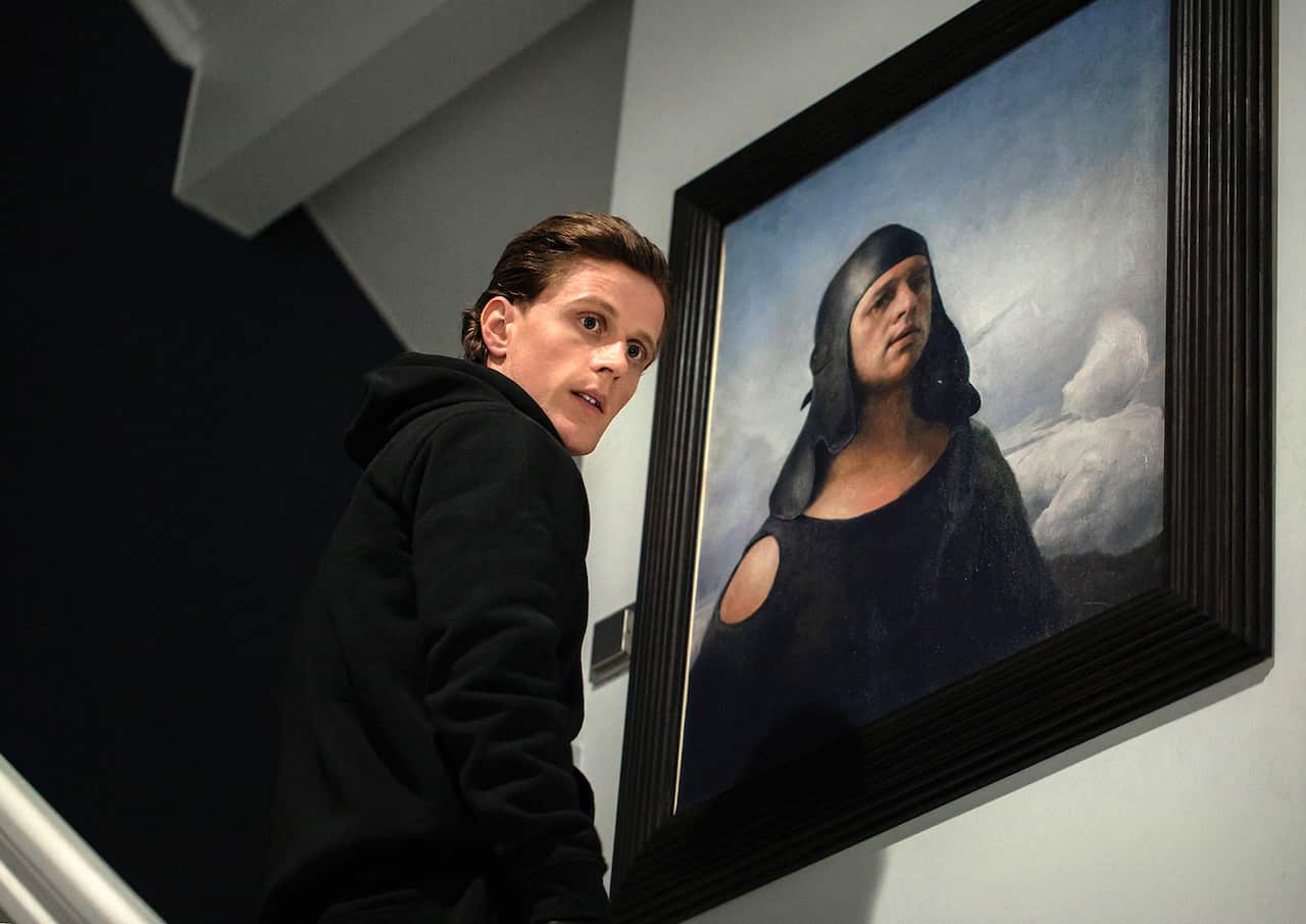 Norwegian actor Axel Bøyum in crime show Headhunters, he looks guilty about to steal a valuable painting.jpg