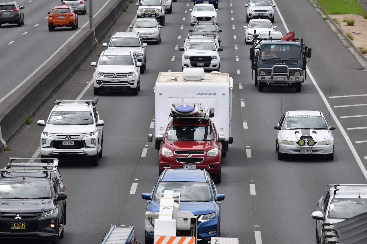 Cars being driven along a motorway.