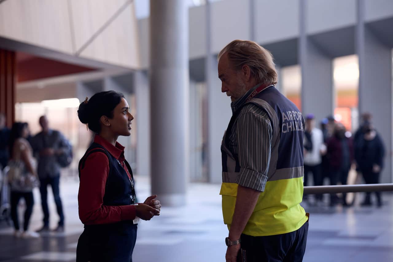 Shabana Azeez as Mira and Hugo Weaving as Tobias in 'The Airport Chaplain'.