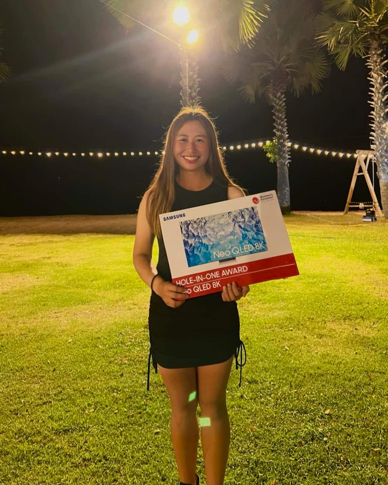 Jeneath Wong with her prize for getting a hole-in-one at the 2022 Women's Amateur Asia-Pacific. 