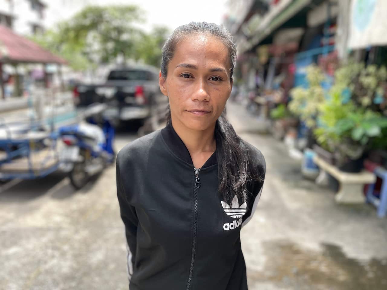 A woman in a black jacket.