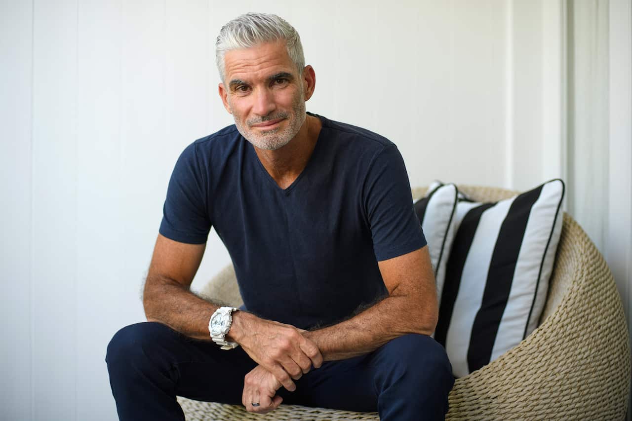Former Socceroo Craig Foster poses for a portrait in a chair