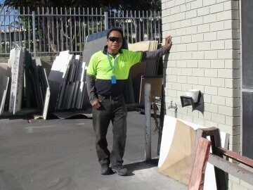 A man in a hi-vis top on a building site