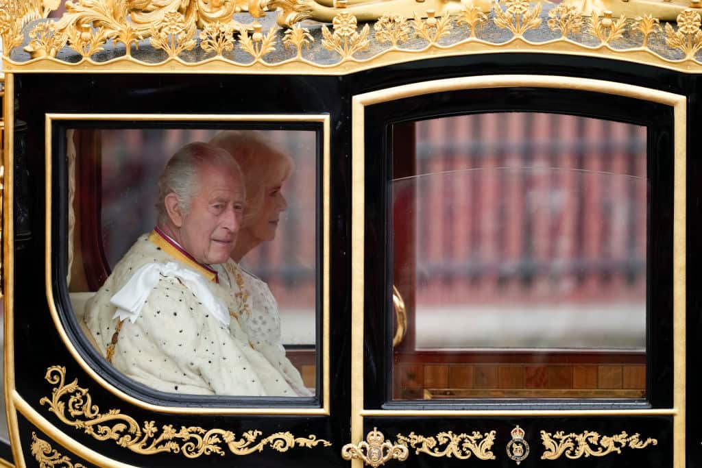King Charles III and Camilla, Queen Consort, travel in the Diamond Jubilee Coach to Westminster Abbey