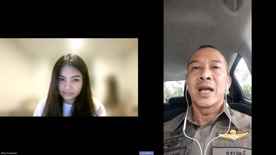 A Thai woman and a Thai man in police uniform speak on mobile phone cameras.