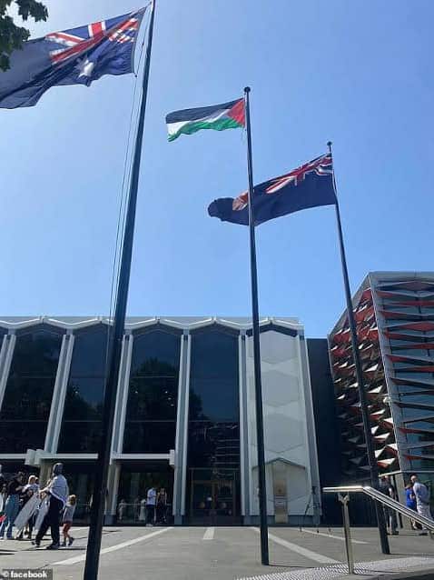 The NSW flag, the Palestinian flag and the Australian flag fly outside Bankstown Town Hall.