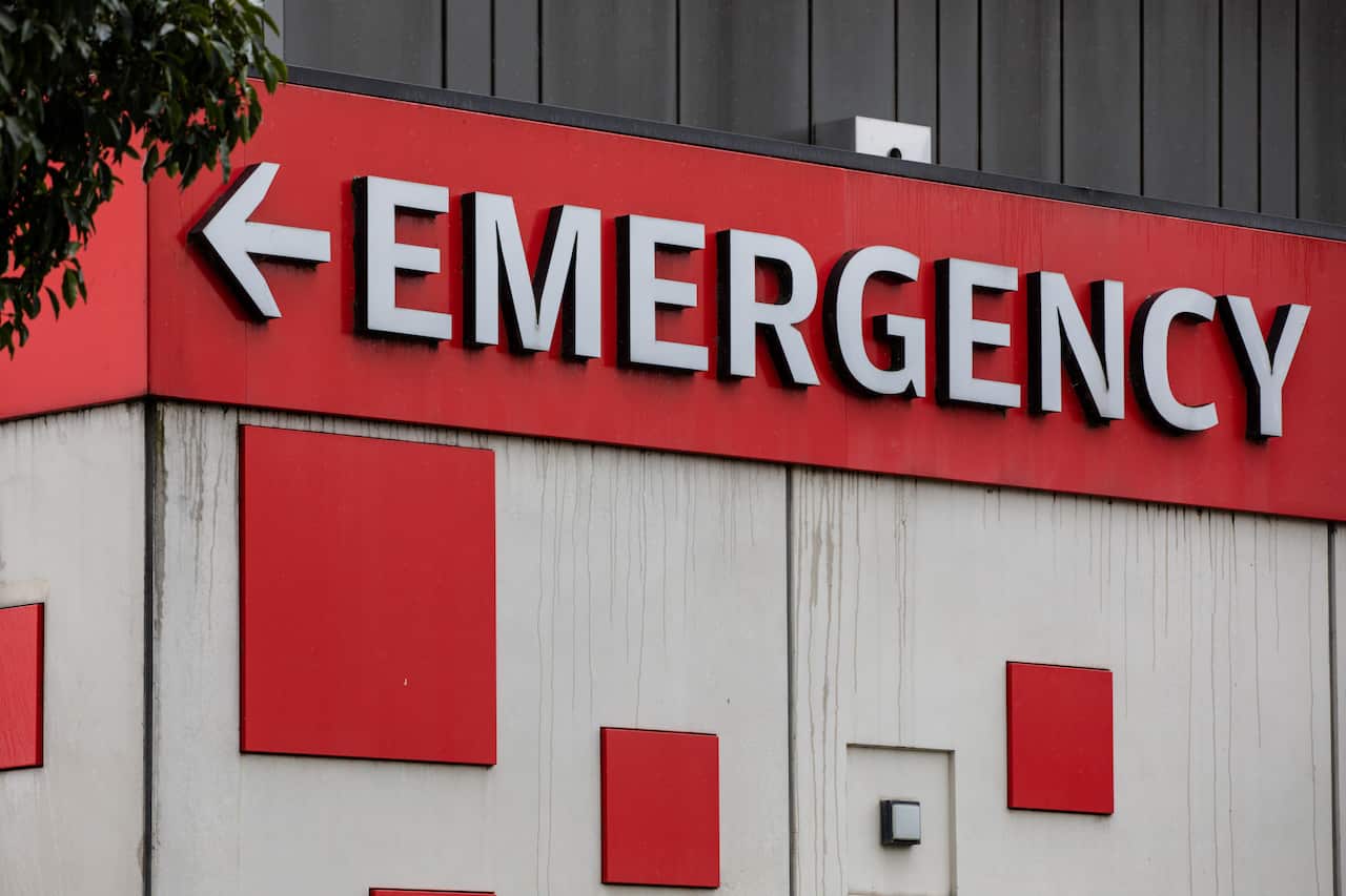 An emergency sign is seen outside a hospital.