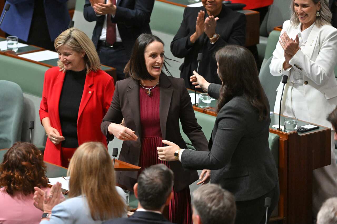 Sarah Witty is applauded after delivering her first speech in the House of Representatives at Parliament House in Canberra