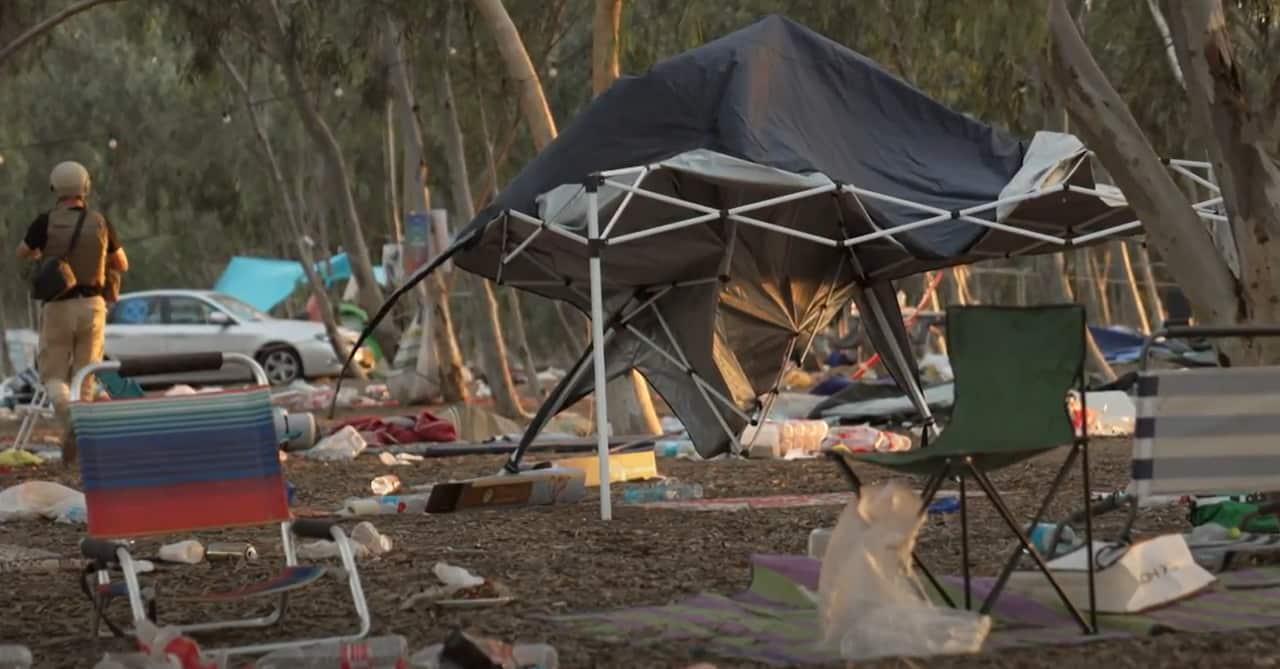 Abandoned chairs and semi-collapsed tents sit abandoned in the campsite of the Supernova festival that was attacked by Hamas militants.