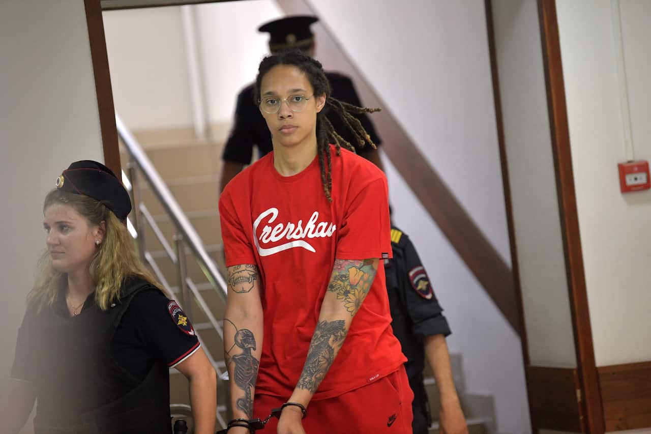 American basketball player Brittney Griner walking into courtroom in handcuffs