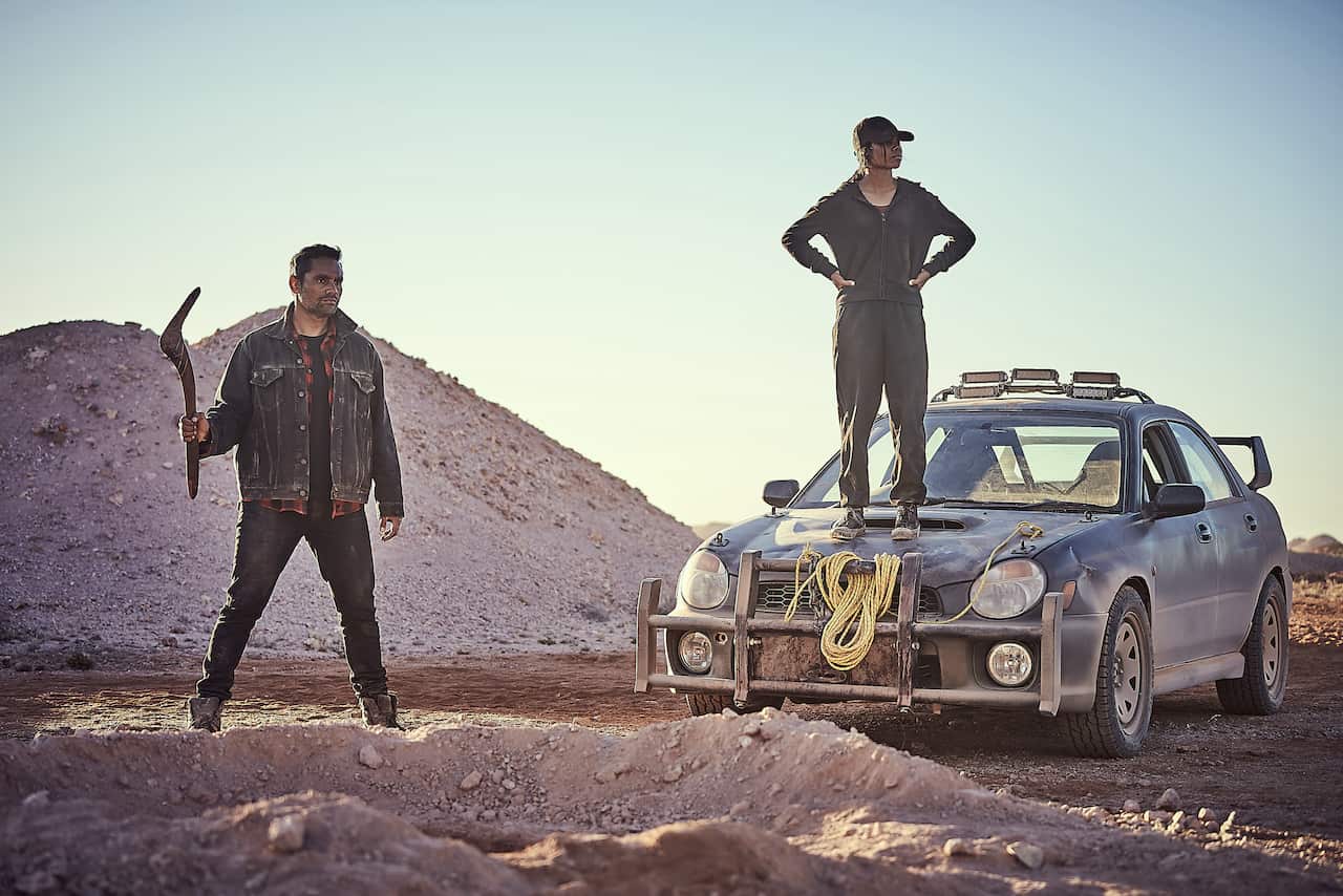 Rob Collins and Shantae Barnes-Cowan in ‘Firebite’, standing in the Australian outback.
