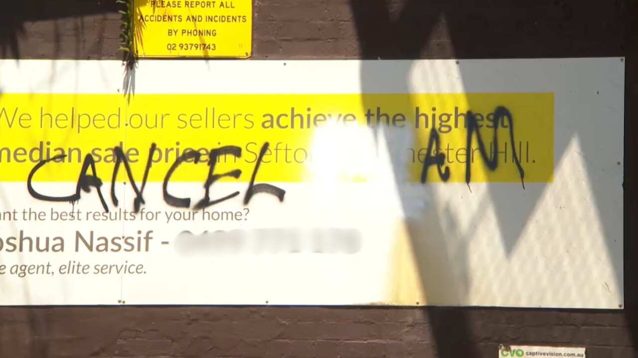 Graffit on a street ad reading 'Cancel Islam' 