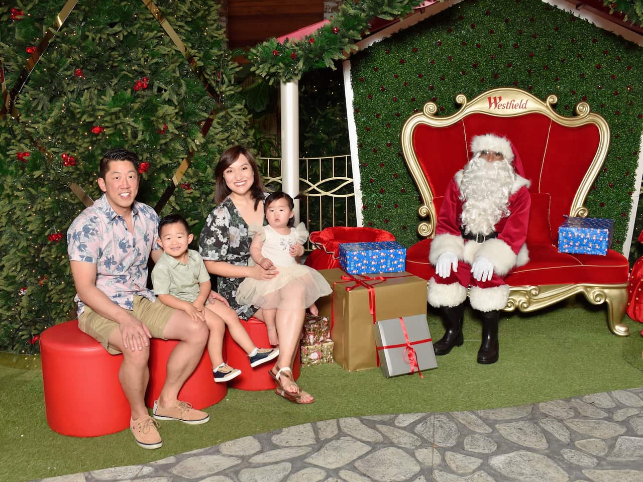 Parents and two children pose with Santa
