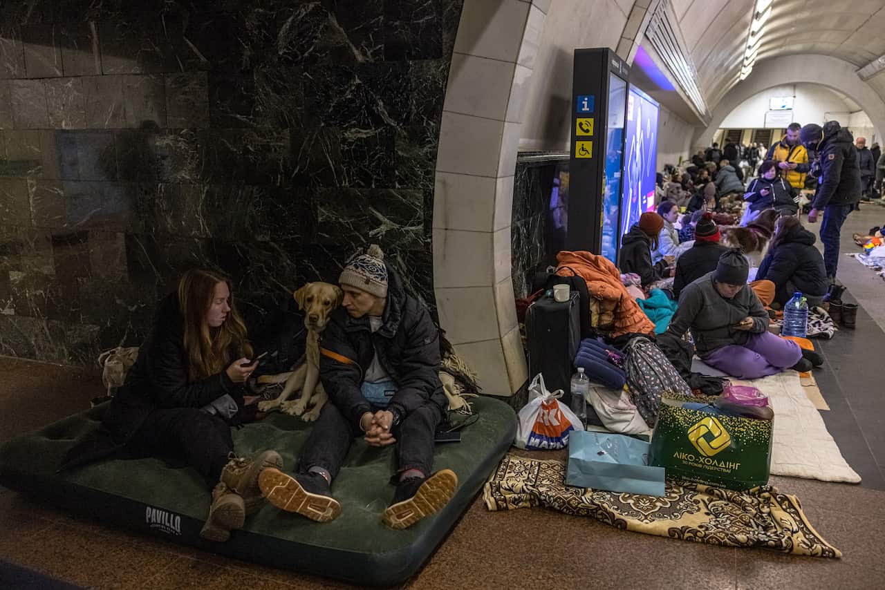 Masses of people stay inside a subway station for use as a bomb shelter in Kyiv, 2 March 2022.