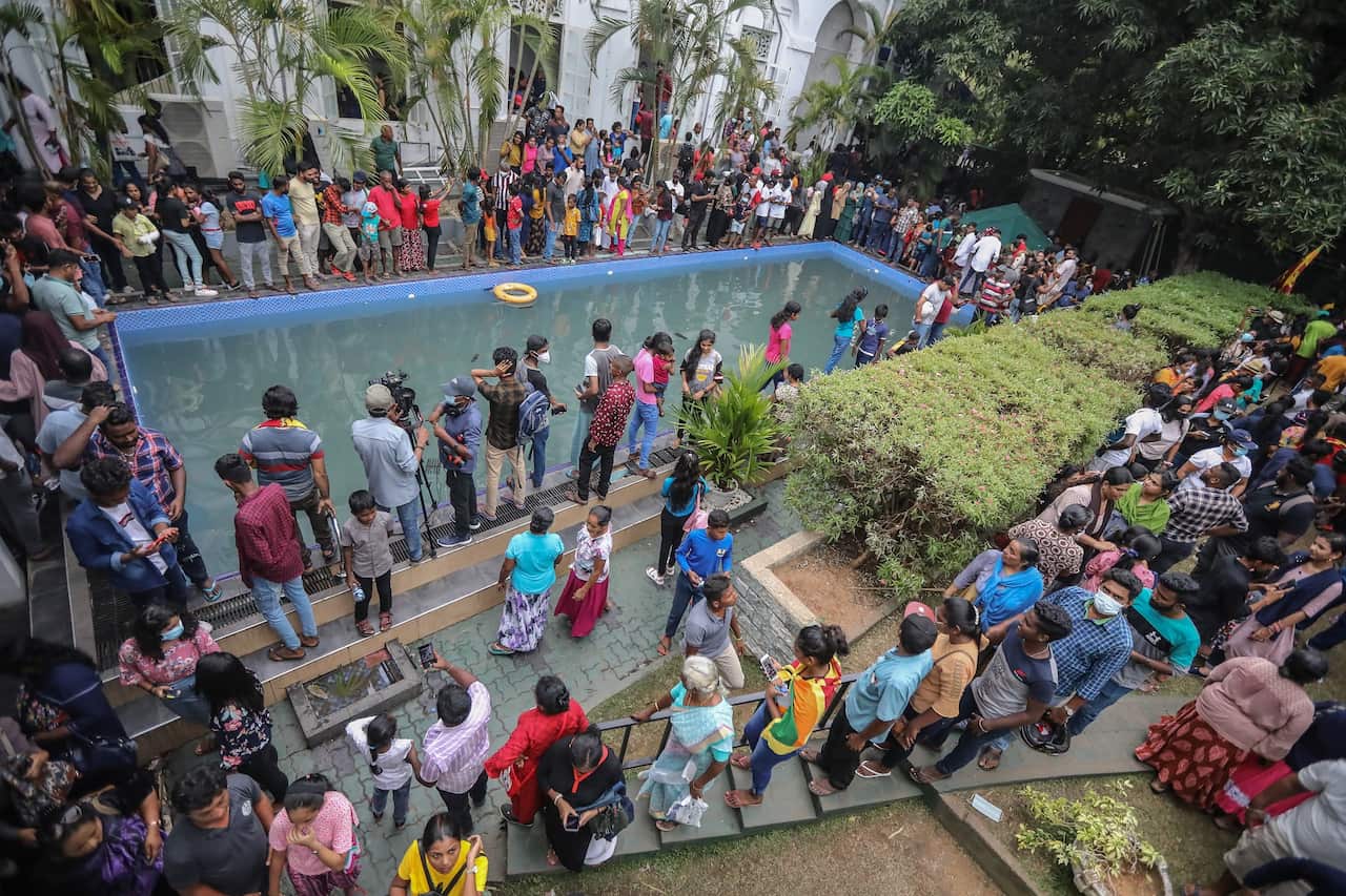 Protesters gathered around a pool at the President's palace in Colombo, Sri Lanka. 