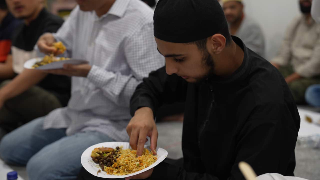 Young volunteer Rayaan embodies the spirit of giving at the Artarmon Mosque's community-sponsored iftar meals.