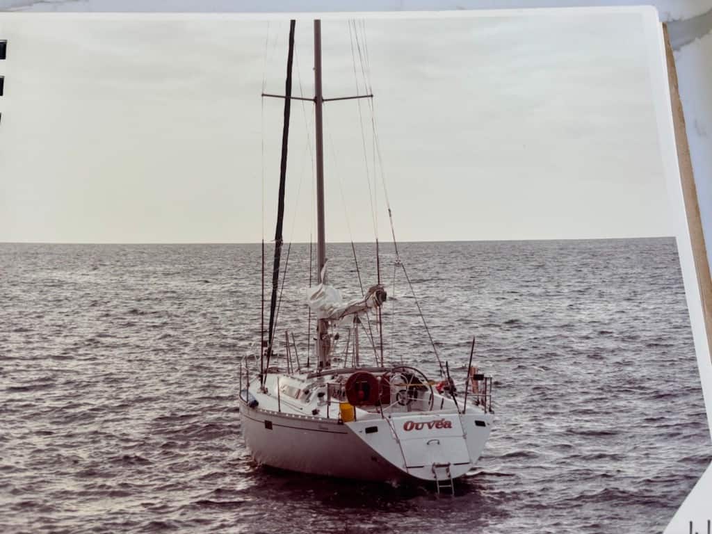 A photograph showing a yacht out on the water.