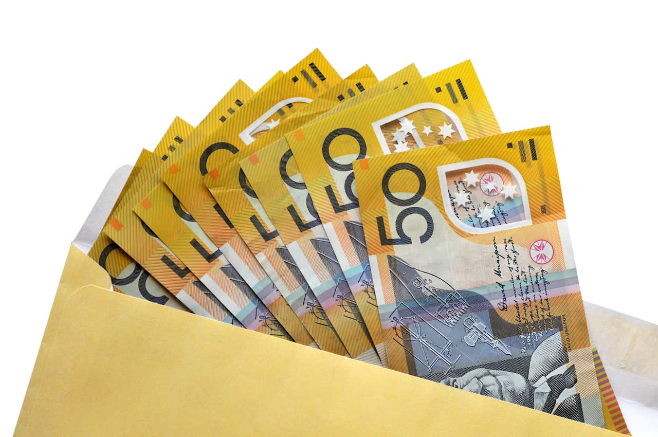 Open envelope of Australian fifty dollar notes