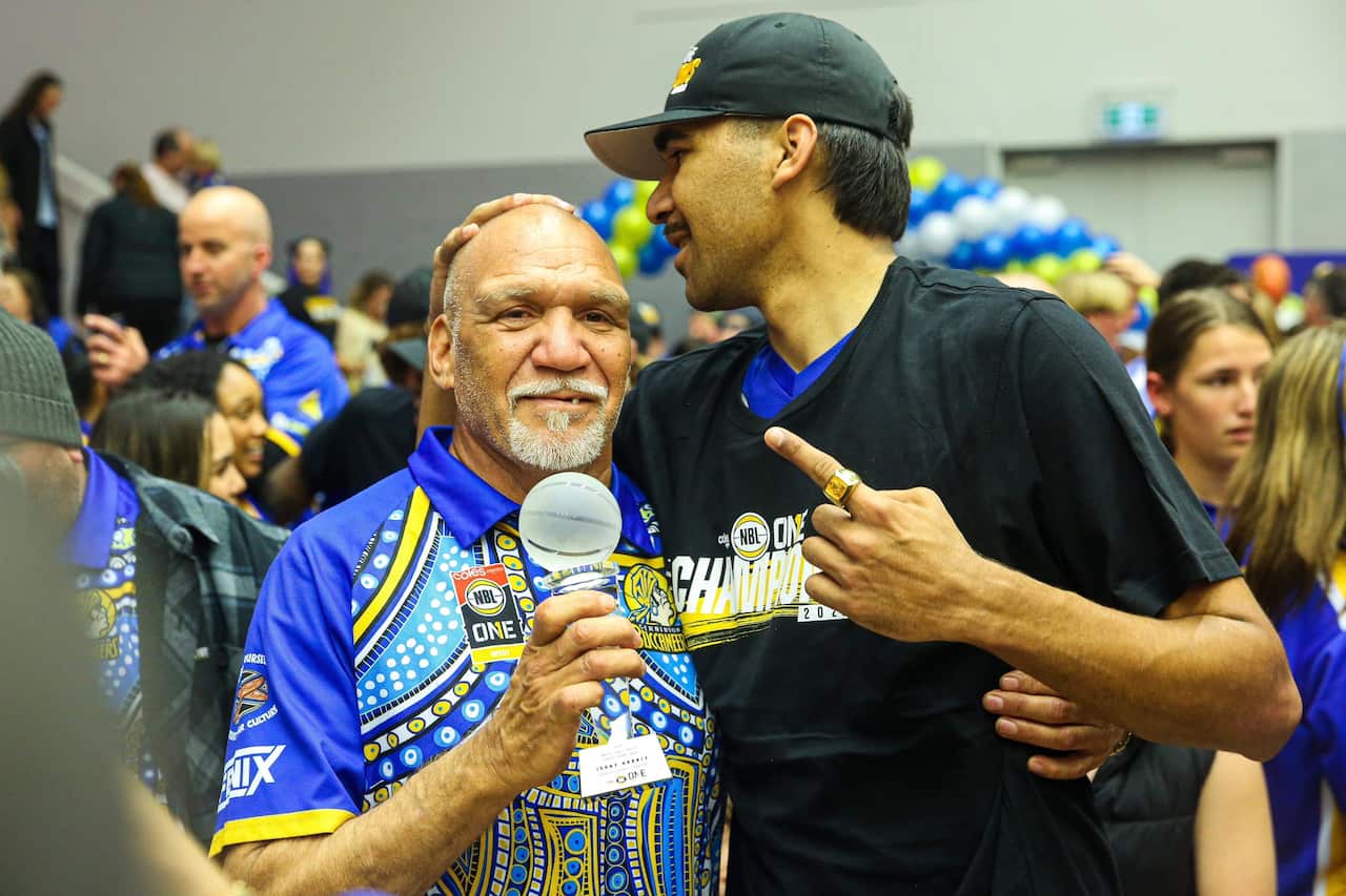 Johhny with his dad after winning MVP.JPG