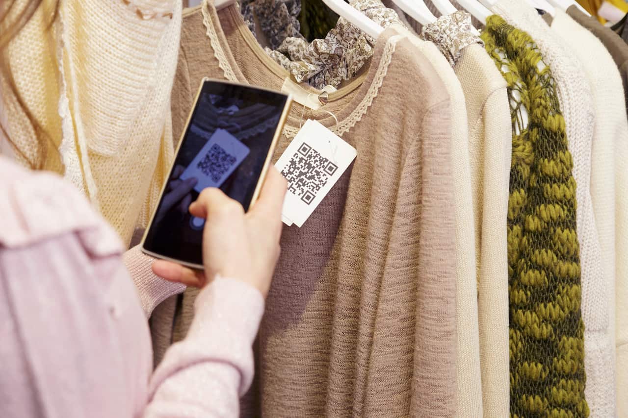 Woman scanning a QR code from a label.