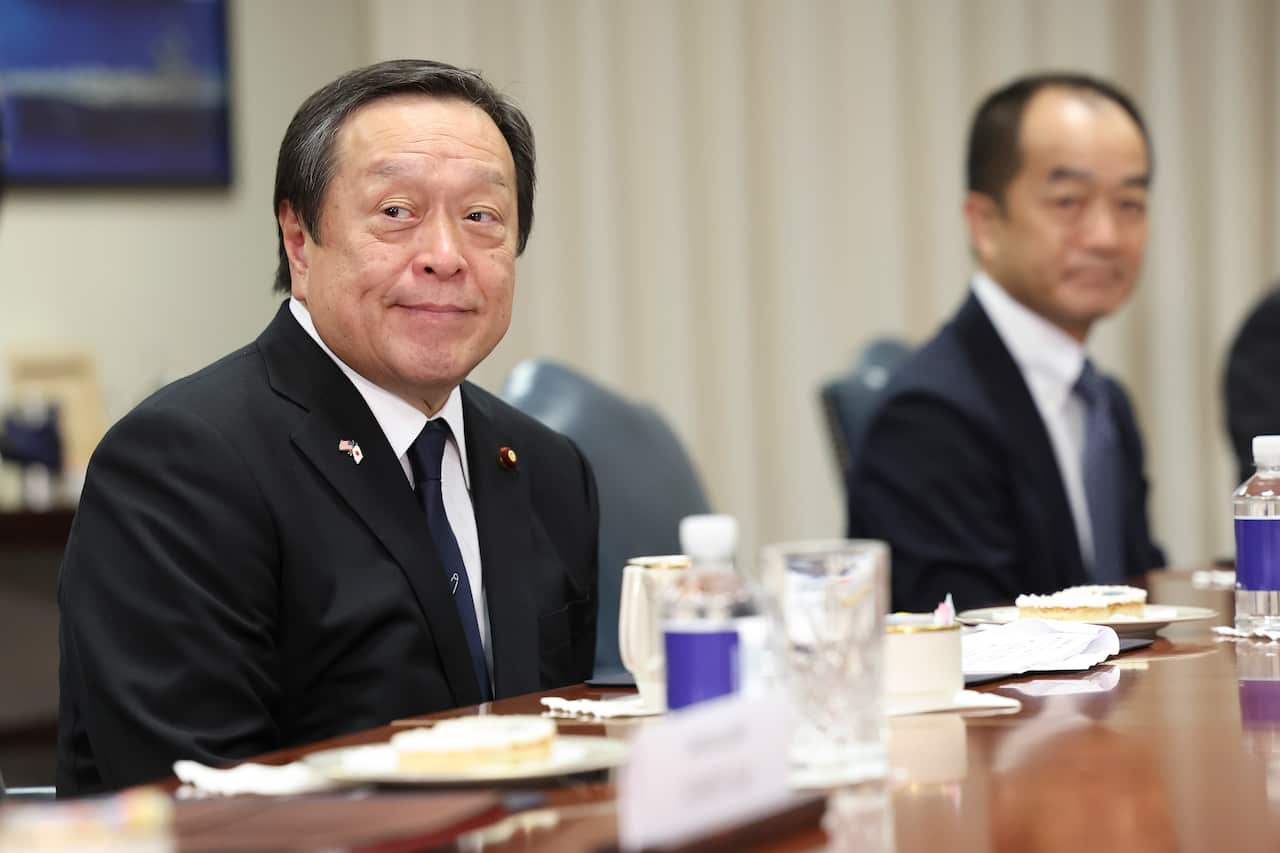 Japanese Defence Minister Yasukazu Hamada sitting at a table.