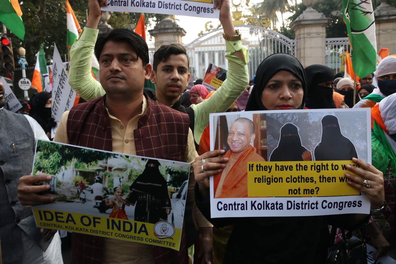 Protestors holding signs