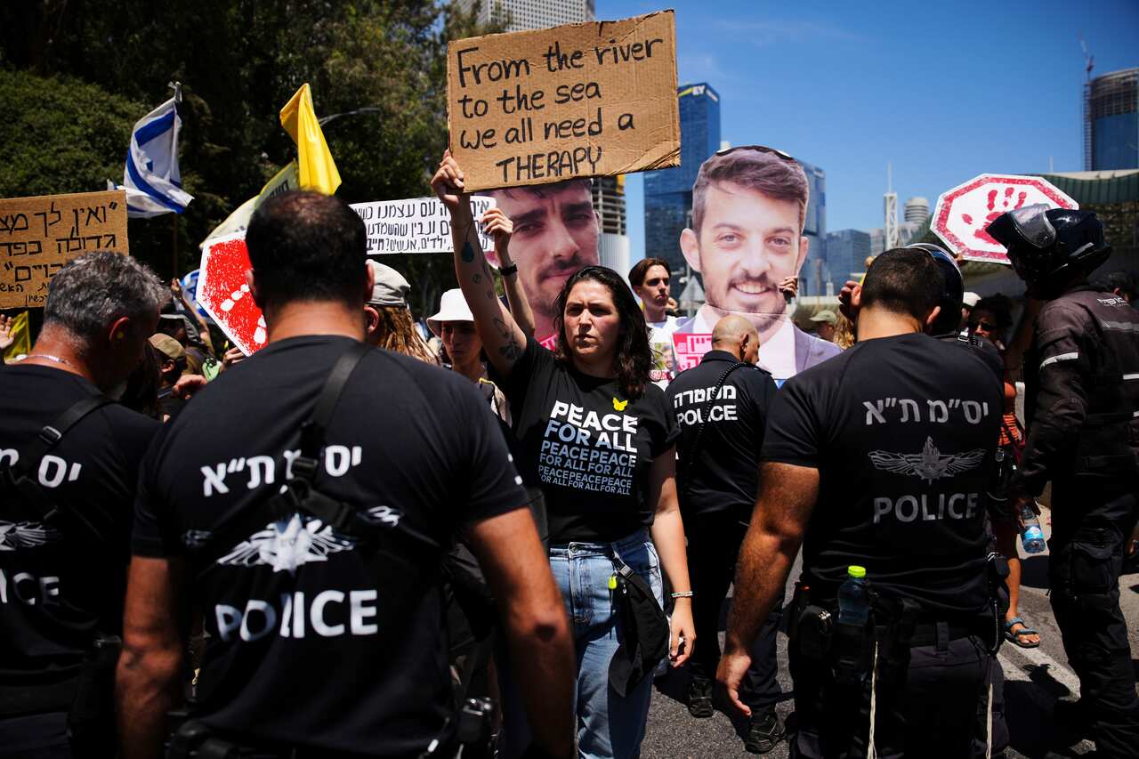 Demonstrators block a road during a protest 