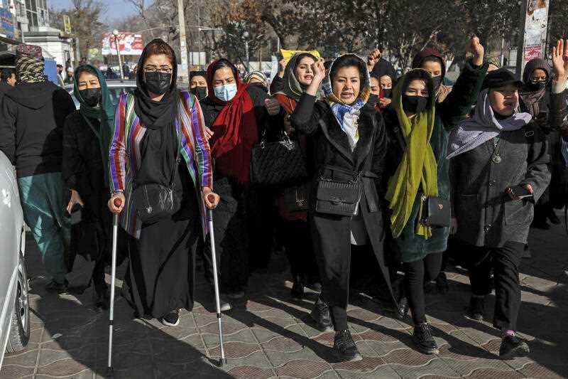 Afghan women chant slogans during a protest against the ban on university education for women, in Kabul, Afghanistan, Thursday, Dec. 22, 2022. 